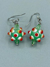 Load image into Gallery viewer, Vibrant color bumpy round lampworked glass bead set of earrings. Colorful light green, white, yellow, and bright red festive piñata shaped bead.  This also reminds me of the shape of a virus. Either way, this is a super fun, unique, bold piece of jewelry, it's sure to make a statement piece.  Measurements: 1 1/4” in length