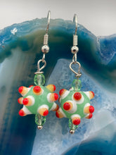 Load image into Gallery viewer, Vibrant color bumpy round lampworked glass bead set of earrings. Colorful light green, white, yellow, and bright red festive piñata shaped bead.  This also reminds me of the shape of a virus. Either way, this is a super fun, unique, bold piece of jewelry, it's sure to make a statement piece.  Measurements: 1 1/4” in length