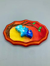 Load image into Gallery viewer, Starry Night Mini Bat Wall Art Decor. A perfect hanging art piece to add a pop of color to your wall, next to your display of crystals or witchy altar. Bat figurine is made of polymer clay, painted ombre colors from light to dark with white stars and crescent moon flying over the sun rise sky. Orange and red wood frame matches the light yellow, orange and red sky. Art come ready to hang with a sawtooth hangers on back. Measurements: H 3" x W 5” x D 1 1/2"