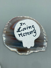 Load image into Gallery viewer, Heal emotionally and spiritually through art by honoring a loved one with a unique and beautiful Purple Spirit Piece Memorial Skull Art. Day Of The Dead Spirit Piece is an ideal addition to your ofrenda or altar that will provide a lasting tribute. These handcrafted polymer clay skull figurines are adorned with hand-painted pink floral designs for the eyes. H 1 1/2” x W 1 1/2” x D 3/4”