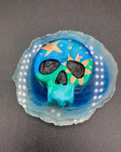 Load image into Gallery viewer, Inspired by nature, this skull statuette is full of vibrant colors and intricate details. The ombre colors from red, to light pink was inspired by the summer sky at sundown that I see all too often. I really wanted to capture those beautiful colors and added metallic gold moon and stars silhouettes to tie it all together.