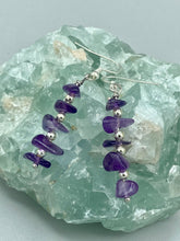 Load image into Gallery viewer, This single strand of beads is composed of natural amethyst stone chips and silver glass beads for a unique, bohemian look. Measurements: 1 1/2 ” in length