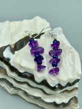 Load image into Gallery viewer, These chic earrings feature a single strand of natural amethyst stone chips and blue glass beads, combining timeless elegance with modern style. Measurements: 1 1/4 ” in length