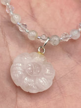 Load image into Gallery viewer, This elegant necklace is adorned with a beautiful rose quartz pendant featuring an intricate floral cutout, complemented by small round rose quartz beads with an iridescent glass finish. Measurements: Necklace is 18 1/2”