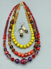 Load image into Gallery viewer, This earring set features cylinder and round bone beads with decorative wavy lines and dot designs, as well as gold-tone glass beads. Neutral colors make these earrings perfect for any occasion - dress them up or down for a look that is sure to be one-of-a-kind. Measurements: 1 5/8 ” in length