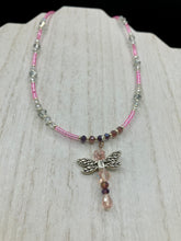 Load image into Gallery viewer, This softy pink and purple choker style necklace with a silver dragonfly pendant is perfect for nature lovers. Glass beads make the necklace adjustable, and it comes with matching dragonfly earrings for a truly magical, fairy princess look. An ideal accessory for summer. Measurements: Necklace is 15 1/2” adjustable up to 18"