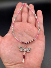 Load image into Gallery viewer, This softy pink and purple choker style necklace with a silver dragonfly pendant is perfect for nature lovers. Glass beads make the necklace adjustable, and it comes with matching dragonfly earrings for a truly magical, fairy princess look. An ideal accessory for summer. Measurements: Necklace is 15 1/2” adjustable up to 18"