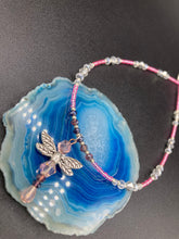 Load image into Gallery viewer, This softy pink and purple choker style necklace with a silver dragonfly pendant is perfect for nature lovers. Glass beads make the necklace adjustable, and it comes with matching dragonfly earrings for a truly magical, fairy princess look. An ideal accessory for summer. Measurements: Necklace is 15 1/2” adjustable up to 18"