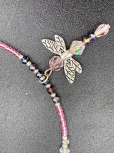 Load image into Gallery viewer, This softy pink and purple choker style necklace with a silver dragonfly pendant is perfect for nature lovers. Glass beads make the necklace adjustable, and it comes with matching dragonfly earrings for a truly magical, fairy princess look. An ideal accessory for summer. Measurements: Necklace is 15 1/2” adjustable up to 18"