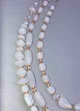 Load image into Gallery viewer, This necklace is the perfect finishing touch to any outfit. Featuring three strands of white and gold glass beads for a classic and elegant look. The small clear and gold glass beads add a touch of sophistication. Adjustable for a comfortable fit. Measurements: Necklace is 17” in length, can be adjusted up to 19 1/2"