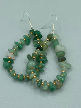 Load image into Gallery viewer, Elegant hoop earrings featuring natural green aventurine stone chips and gold-tinged glass beads. Measurements: 2" length and 1 1/2” in width