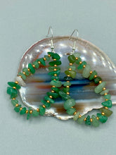 Load image into Gallery viewer, Elegant hoop earrings featuring natural green aventurine stone chips and gold-tinged glass beads. Measurements: 2" length and 1 1/2” in width