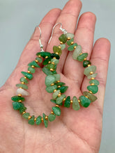 Load image into Gallery viewer, Elegant hoop earrings featuring natural green aventurine stone chips and gold-tinged glass beads. Measurements: 2" length and 1 1/2” in width