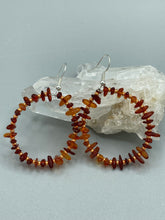 Load image into Gallery viewer, These hoop earrings feature natural amber stone chips and gold glass beads for an elegant, nature-inspired look. Measurements: 2" length and 2” in width
