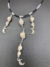 Load image into Gallery viewer, Massive beautiful bold cascade of skulls goth witchy necklace is the ultimate statement piece to add to your jewelry collection! Three strands full of howlite skull beads draping down with smiling crescent moon charms. Chingona, Cabrona, Latina Chicana, Goth, Vampire Goth, Dark Witchy Style. You can dress these up or down, it will definitely give your outfit a unique look.  Measurements: 17” adjustable up to 19" in length