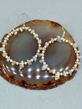 Load image into Gallery viewer, Delicate white moon stone chip and glass beaded hoop earrings featuring chic gold accents and tiny conch shells. Perfect for nature lovers, these boho-inspired summer earrings will add a subtle sophistication to any outfit. Measurements: 2" length
