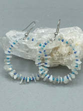 Load image into Gallery viewer, These nature-inspired White Moon Stone Chip Beaded Hoop Earrings are the perfect accessory for adding a boho-chic vibe to any look. Crafted with natural white moon stone chips and blue glass beads, these earrings will complete your outfit with the ultimate hippie and shabby-chic feel. Measurements: 1 1/2" length