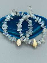 Load image into Gallery viewer, Crafted with natural white moonstone chips, blue glass beads and tiny conch shells, these hoop earrings are a bohemian statement piece. Perfect for nature and beach lovers, they add a touch of shabby chic to any summer look. Measurements: 2" length