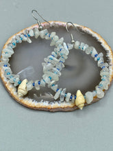 Load image into Gallery viewer, Crafted with natural white moonstone chips, blue glass beads and tiny conch shells, these hoop earrings are a bohemian statement piece. Perfect for nature and beach lovers, they add a touch of shabby chic to any summer look. Measurements: 2" length