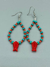 Load image into Gallery viewer, This eye-catching pair of earrings features vibrant fire engine red fish glass beads, accented with small teal, red, and golden glass beads. Each fish bead boasts detailed fins and eyes, creating a bright and captivating piece of jewelry measuring 2" in length.