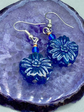 Load image into Gallery viewer, This Dark Blue Violet Floral Pressed Glass Beaded Earrings feature a captivating iridescent shimmer finish that adds beautiful detail. Measurements: 1 1/4" length