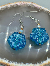 Load image into Gallery viewer, This light blue pressed glass floral bracelet is a sophisticated addition to any summer look. Its iridescent shimmer finish adds a classy touch to its intricate metal wire and lobster claw clasp. Perfect for any nature-inspired wardrobe. Measurements: Bracelet: 8" in length Earrings: 1 1/4" length