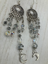 Load image into Gallery viewer, Whimsical Celestial Smiling Crescent Moons Large Chandelier Earrings. Five strands of beautiful clear iridescent glass beads and dangling smiling crescent moon charms. This is perfect for any outfit and will surely stand out. Measurements:  4” in length. Witchy, Whimsical, Goth, Luna Lovers, Crescent Smiling Moons