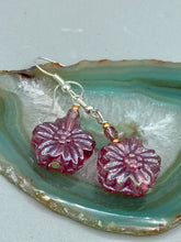 Load image into Gallery viewer, Add a touch of bohemian style to your look with these unique light purple pink flower glass earrings. Featuring detailed pressed glass beads and an iridescent shimmer finish, these earrings are perfect for a hippie vibe, shabby chic, or boho chic look. Nature-inspired and chic, these are the perfect earrings for any occasion. Measurements: 1 1/4" length