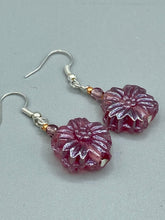 Load image into Gallery viewer, Add a touch of bohemian style to your look with these unique light purple pink flower glass earrings. Featuring detailed pressed glass beads and an iridescent shimmer finish, these earrings are perfect for a hippie vibe, shabby chic, or boho chic look. Nature-inspired and chic, these are the perfect earrings for any occasion. Measurements: 1 1/4" length