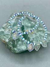 Load image into Gallery viewer, These Pressed Glass Leaf Beaded Hoop Earrings are perfect for a shabby chic, bohemian, or hippie vibe. The iridescent glass beads give off a soft and glamorous sparkle, while the clear glass charms have a shimmer finish with hints of gold, purple, blue and pink. They are the perfect nature-inspired accessory. Measurements: 2" length