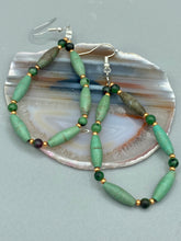 Load image into Gallery viewer, These stylish fish hook style earrings feature intricate beadwork crafted with forest green magnesite and ruby zoisite stones. Measurements: 2 3/4" length