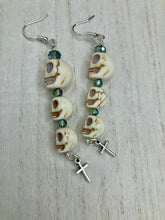 Load image into Gallery viewer, For The Dark Souls Three Howlite Skull Beads Light Blue Iridescent Glass Bead Earrings Dangling Silver Plated Cross Give These Earrings Movement. Chingona, Cabrona, Latina Chicana, Goth, Vampire Goth, Dark Witchy Style. You can dress these up or down, it will definitely give your outfit a unique look.  Measurements: 3 ” in length