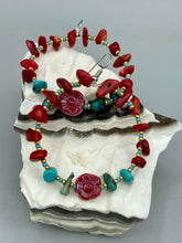 Load image into Gallery viewer, These Bamboo Coral Red Stone Chip earrings are complemented by turquoise and gold glass beading and a shimmery red pressed glass flower charm. The charm's iridescent shimmer finish has subtle hues of gold, purple, blue and pink. Measurements: 2" length