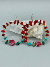 Load image into Gallery viewer, These Bamboo Coral Red Stone Chip earrings are complemented by turquoise and gold glass beading and a shimmery red pressed glass flower charm. The charm's iridescent shimmer finish has subtle hues of gold, purple, blue and pink. Measurements: 2" length