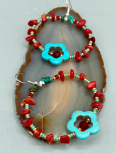 Load image into Gallery viewer, These earrings feature a turquoise magnesite floral bead with a dark red glass bead in the center and artfully beaded with bamboo red coral and turquoise stones. Measurements: 1 3/4" length