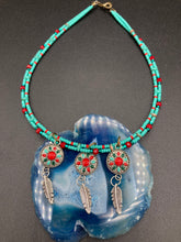Load image into Gallery viewer, This two-stranded necklace features a vibrant Southwest-inspired design. Hand-beaded turquoise, bright red, and dark green colors, along with silver-plated feather charms, add dynamic movement to the piece. An ideal set for chingona guerrera carbonas, la India princesses, warrior cosplay, and other native-inspired looks. Measurements: Necklace is 15” adjustable up to 18" in length