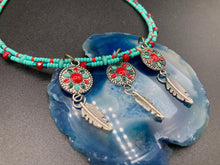 Load image into Gallery viewer, This two-stranded necklace features a vibrant Southwest-inspired design. Hand-beaded turquoise, bright red, and dark green colors, along with silver-plated feather charms, add dynamic movement to the piece. An ideal set for chingona guerrera carbonas, la India princesses, warrior cosplay, and other native-inspired looks. Measurements: Necklace is 15” adjustable up to 18" in length