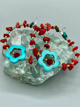 Load image into Gallery viewer, These earrings feature a turquoise magnesite floral bead with a dark red glass bead in the center and artfully beaded with bamboo red coral and turquoise stones. Measurements: 1 3/4" length