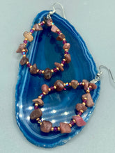 Load image into Gallery viewer, These pure rhodonite stone chip earrings with lustrous fuchsia and gold glass beading boast shimmering accents of blue, gold, and purple. Measurements: 2 1/4" length