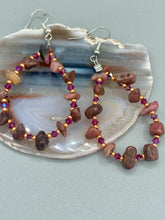 Load image into Gallery viewer, These pure rhodonite stone chip earrings with lustrous fuchsia and gold glass beading boast shimmering accents of blue, gold, and purple. Measurements: 2 1/4" length
