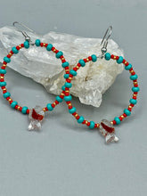 Load image into Gallery viewer, This eye-catching set of earrings features intricately detailed koi fish glass beads, accompanied by smaller teal, red, and gold-hued glass beads. With their bold and vibrant colors, they make a striking statement. Measurements: 2 1/4” in length