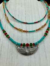 Load image into Gallery viewer, Three strands of Southwestern Style Inspired Adjustable Choker Beaded Necklace features an eye-catching blend of vibrant turquoise, red, green, gold, and yellow glass beads, accented with a wide silver plated tribal pattern pendant. Measurements: Necklace is 15 1/2” adjustable up to 18" in length