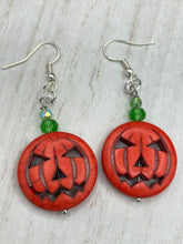 Load image into Gallery viewer, These cute set of Jack O Lantern large orange pumpkin bead earrings really captures the essence of Halloween. I added green glass beads to bring a pop of shimmer and color.  Measurements: 1 3/4 ” in length
