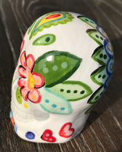 Load image into Gallery viewer, Bring Southwest beauty to any space with this unique ceramic sugar skull art. Hand-painted with bright colors, this piece captures the spirit of Sedona in a Dia de Los Muertos ofrenda. Let this delightful piece evoke the magical beauty of the amazing landscape you'll never forget. H 2 3/4” x W 2” x D 2”