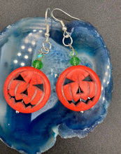 Load image into Gallery viewer, These cute set of Jack O Lantern large orange pumpkin bead earrings really captures the essence of Halloween. I added green glass beads to bring a pop of shimmer and color.  Measurements: 1 3/4 ” in length