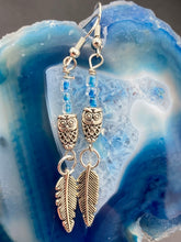 Load image into Gallery viewer, Silver And Blue Wise Owl Charm Choker Style Glass Beaded Necklace. Whimsical and elegant necklace has two different styles of tiny cute owls with silver plated feathers. Some say wearing an owl pendant around your neck is just want you need for a better connection to your intuition. Owls symbolize wisdom, the wisdom that comes to prevent hasting rushing or being impulsive. Necklace comes with matching earrings, necklace is 16” adjustable up to 18" in length - hanging owls and feather pendant are 2” Height