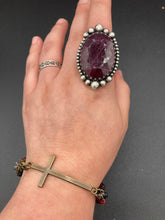 Load image into Gallery viewer, For Positivity and Faith, Shimmery Red And Black Glass Beaded Bracelet With Curved Horizontal Brass Cross. This bracelet has a large brass cross that is slightly curved to be comfortably worm around your wrist.  I created four different black and red glass beads strands. Measurements: 7 1/2" in length, brass cross measures 2" in length.