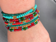 Load image into Gallery viewer, Vibrant And Enchanting Southwest Style Jewelry. This stunningly bold statement piece contains nine beaded strands full of variant turquoise, bright and dark reds and greens, golds and yellows. I created this beautiful jewelry piece by using a wide variety of different bead shapes from large and small round, round tubes, and squares. Measurements: 7 1/2" in length