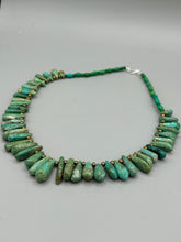 Load image into Gallery viewer, This striking Extra Large Turquoise Stone Beaded Necklace With Brass Finish Metal Beads instantly adds a touch of luxury to any outfit. Beautifully crafted with an alluring blend of extra large turquoise stone beads and brass finish metal beads, this distinctive necklace invokes an elegant cascade of vibrant color.    Measurements:    Necklace is 21 1/2 &quot; in length adjustable to 23&quot;
