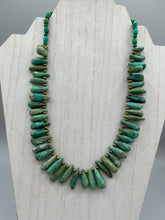 Load image into Gallery viewer,  This striking Extra Large Turquoise Stone Beaded Necklace With Brass Finish Metal Beads instantly adds a touch of luxury to any outfit. Beautifully crafted with an alluring blend of extra large turquoise stone beads and brass finish metal beads, this distinctive necklace invokes an elegant cascade of vibrant color.    Measurements:    Necklace is 21 1/2 &quot; in length adjustable to 23&quot;
